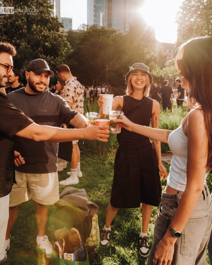 Whether brought along or bought at the bar, cool drinks are enjoyed together in an urban setting during day drinking (Photo: Christopher Lehmann)